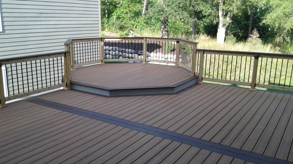 Spacious composite deck installed by Minnesota carpenters.
