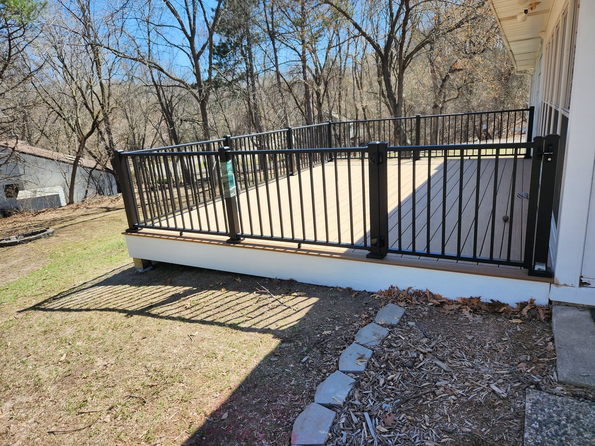 Simple back deck with natural wood finish, built by Minnesota carpenters