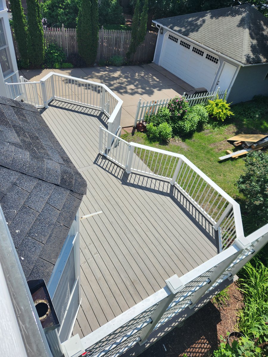 Weather-resistant composite deck in Minnesota backyard.