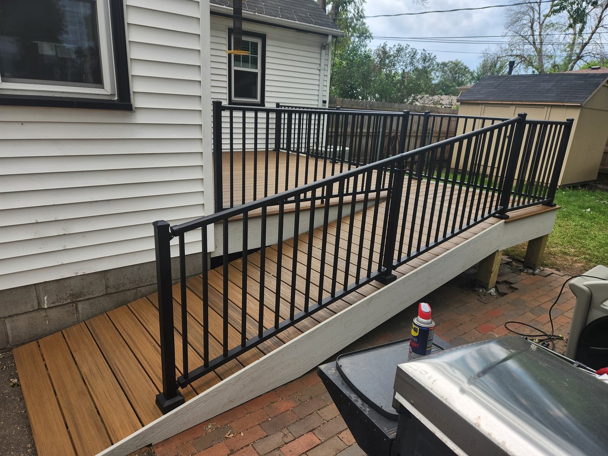 Deck with ADA-compliant ramp and railings for accessibility