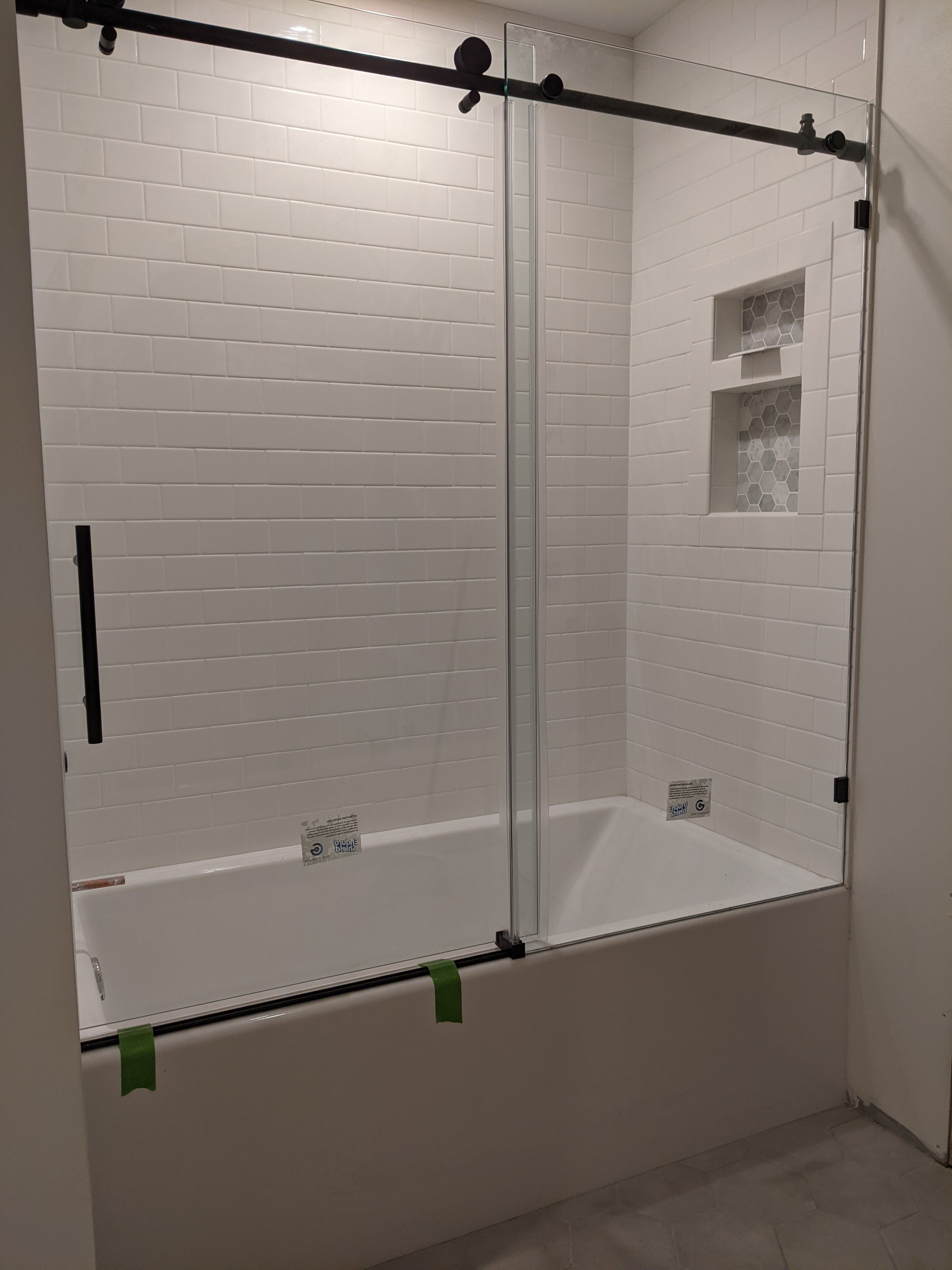 Modern Bathroom Shower Remodel With Custom Tile Work By Home Visions Carpentry in Minnesota.