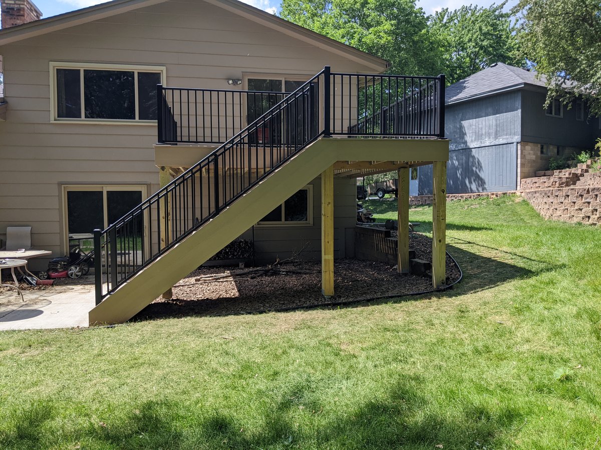 Newly built backyard deck by Minnesota carpentry company